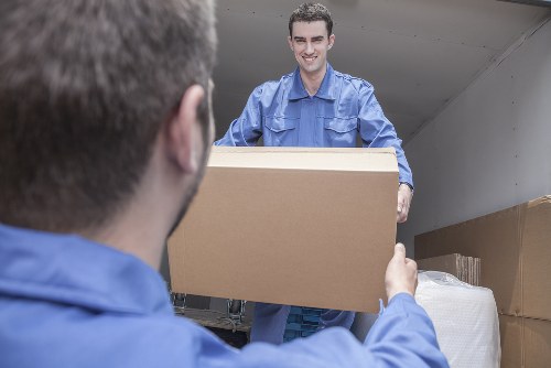 Team preparing a safe moving van with organised equipment