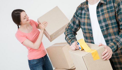 Moving boxes and furniture prepared for transport in East London