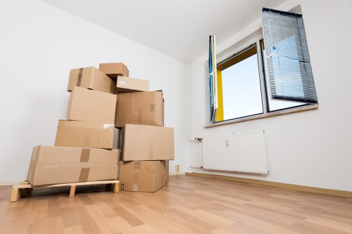 Packing fragile household items for a move in the Isle of Dogs